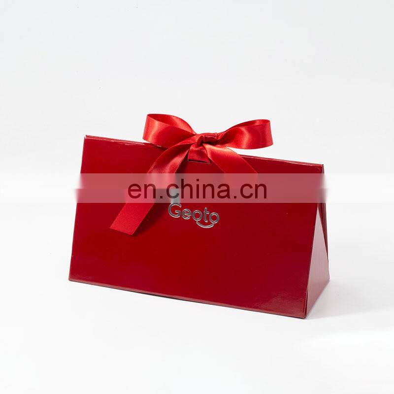 Custom brand logo printing creative red foldable triangle rigid cosmetic gift packaging box with ribbon bow