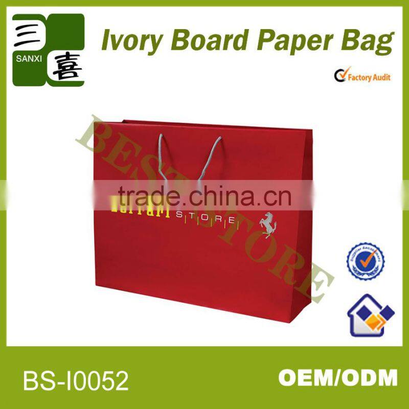 red printed paper gift carry bag with ribbon
