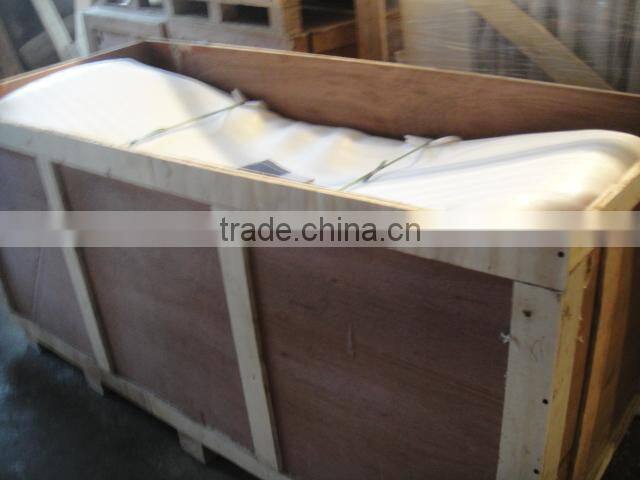 rectangular freestanding cast iron bathtub with wooden cradle