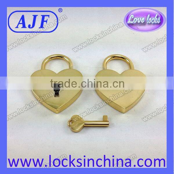 Heart shaped lock and key with gold color