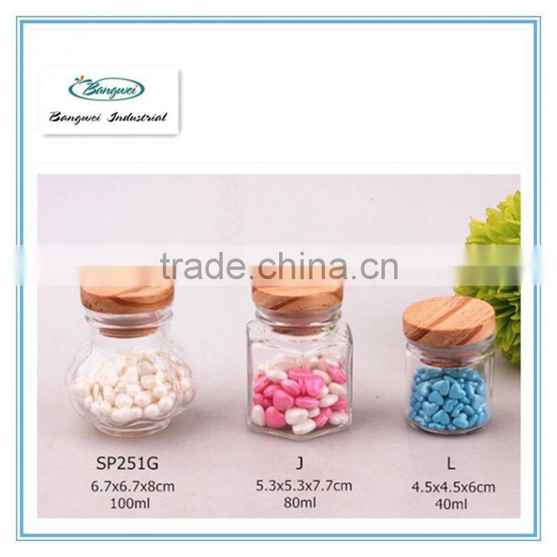 small glass spice jar with wooden lid