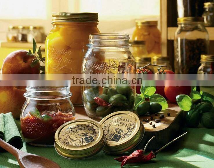 Glass storage jar with gold color metal lid
