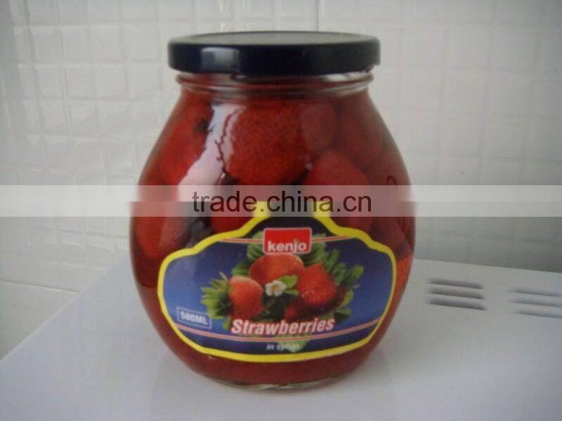 canned Strawberry fruits in light syrup in glass jar