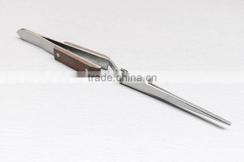 TWEEZERS CROSS LOCKING