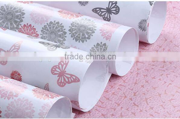 Ivory plastic gift wrapping paper roll
