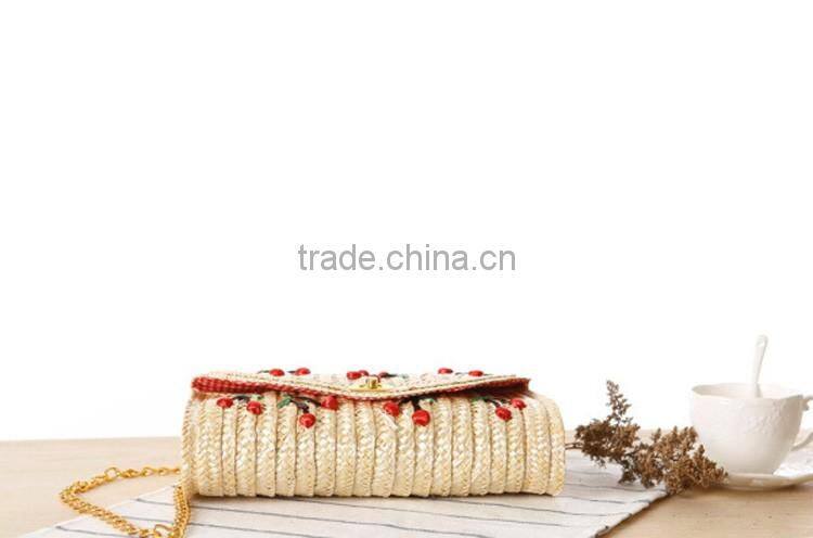 straw clutch bag with cherry pattern, gold chain cross body