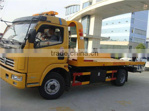 small flatbed towing truck