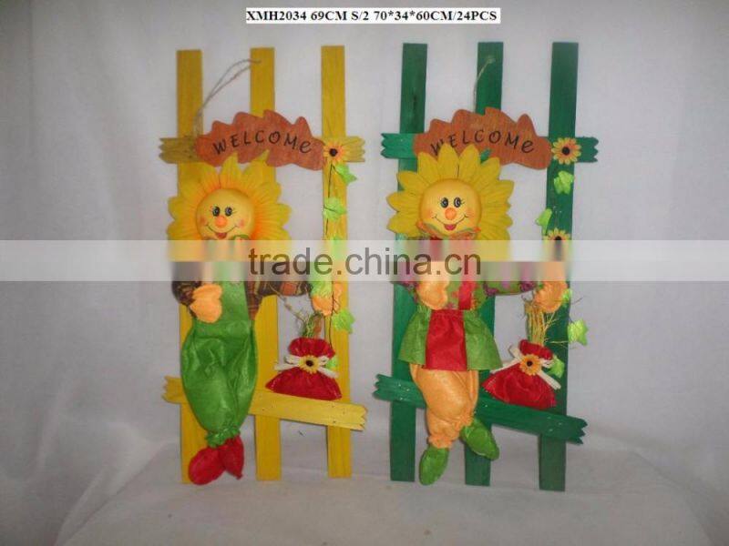 Paper straw and fabric scarecrow for autumn and harvest decoration