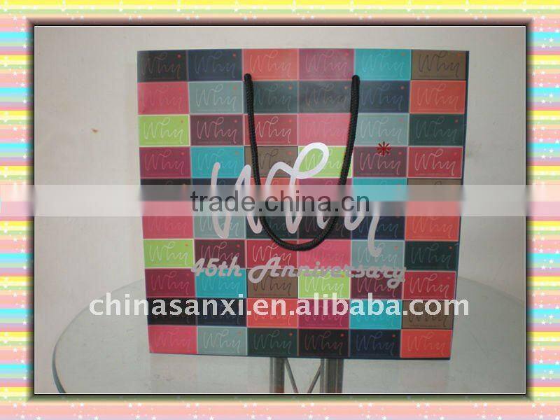 quality designer printed paper carrier bag with silver stamping logo