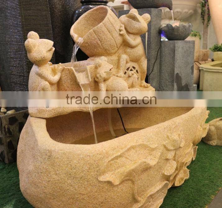 flowing water yellow sandstone fountain