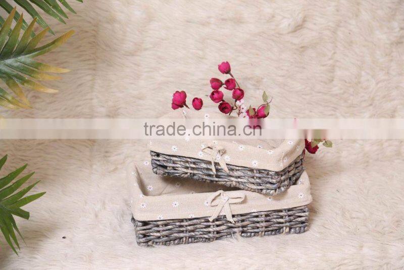 set of 2 maize weaved remote storage baskets