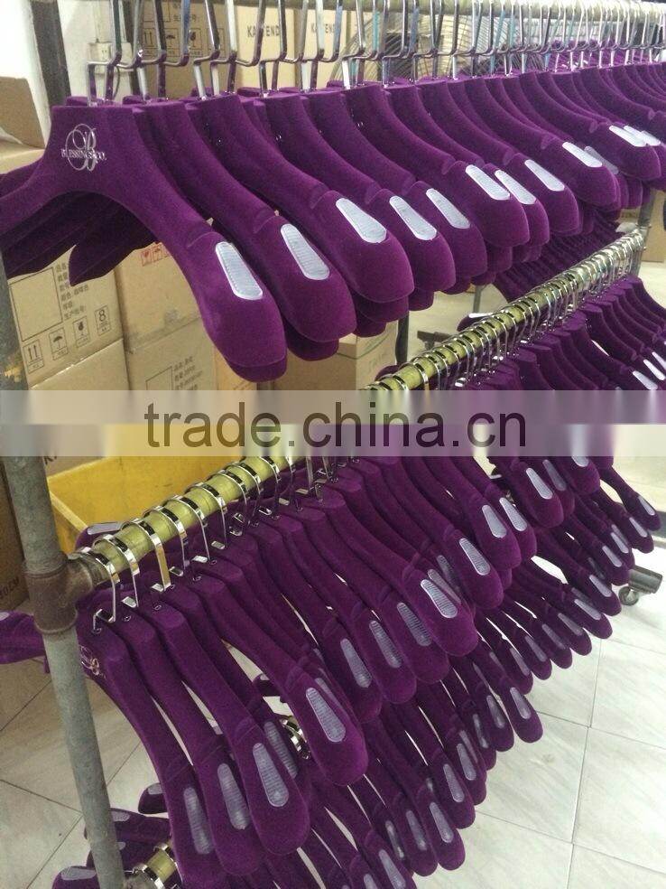 Black nonslip velvet flocked hanger with logo and gold hook for coat