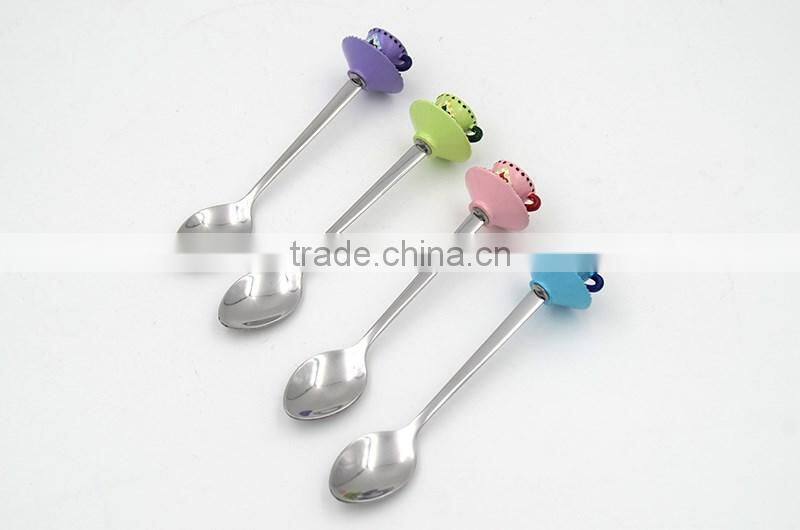 Green colored tea cup handle cake spoon
