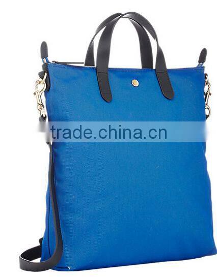 blue fabric small tote shopper bag with black smooth leather trim