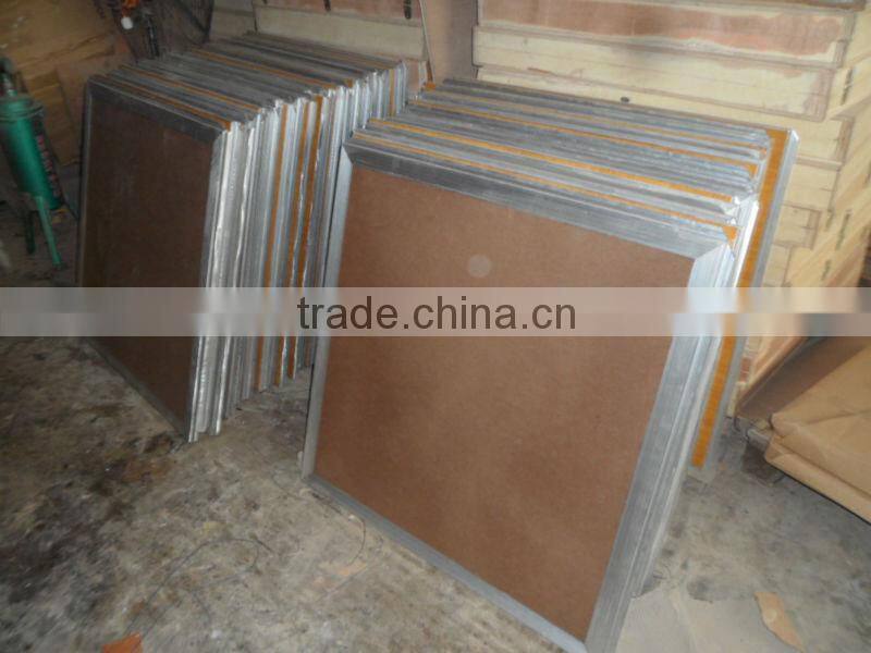 Natural teak wooden dance floor with gold anodized aluminum trim