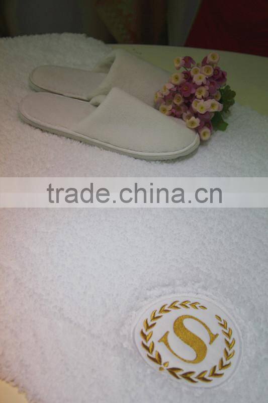 cotton bath rug hand tuffted with embroidered logo