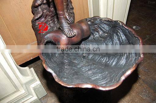 Bronze lady statue with shell water fountain