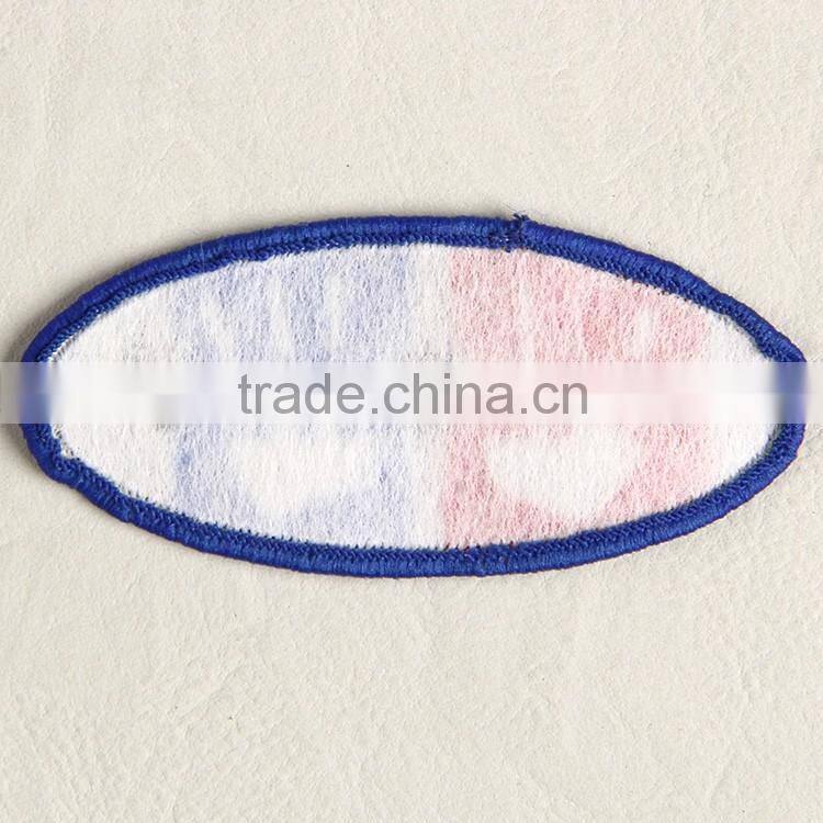 Customize elliptical shaped woven tag with binding for boy's brocade sweater