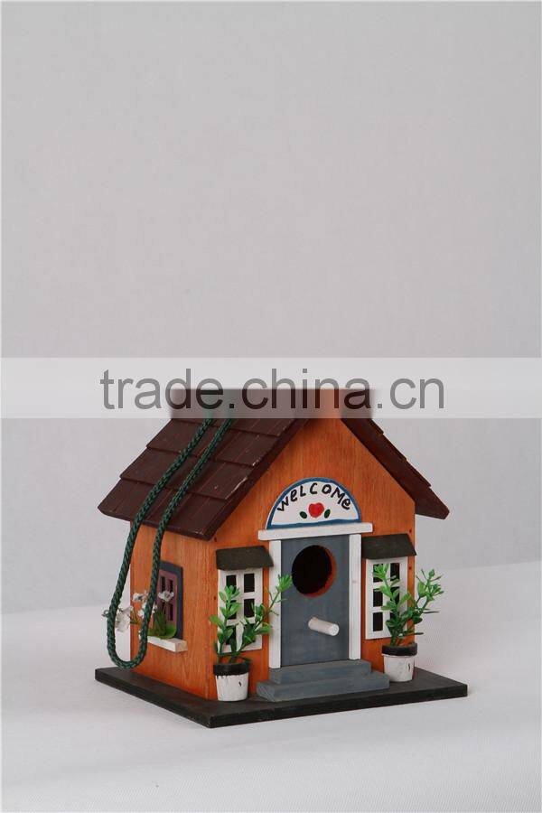 New wooden yellow colored birdhouse for decoration birdcage