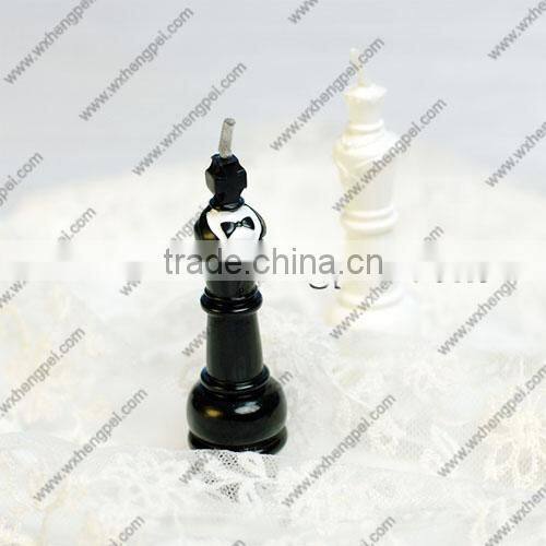 Wedding candles on the chess king and queen