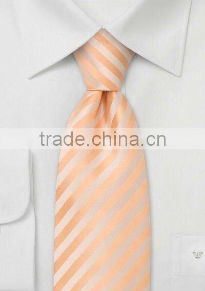 peach colored poly neckties with diagonal stripes