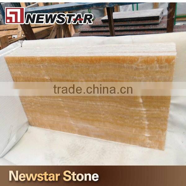 Backlit transparent honey yellow onyx marble tiles