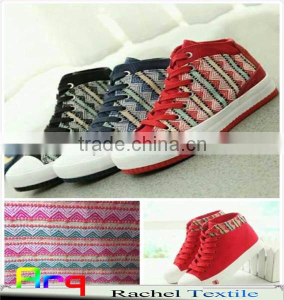 Multi colored fabric with many bright color, stripe design using for home textile or garments