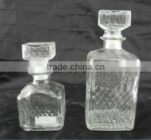 square glass wisky russian liqueur bottle with lid