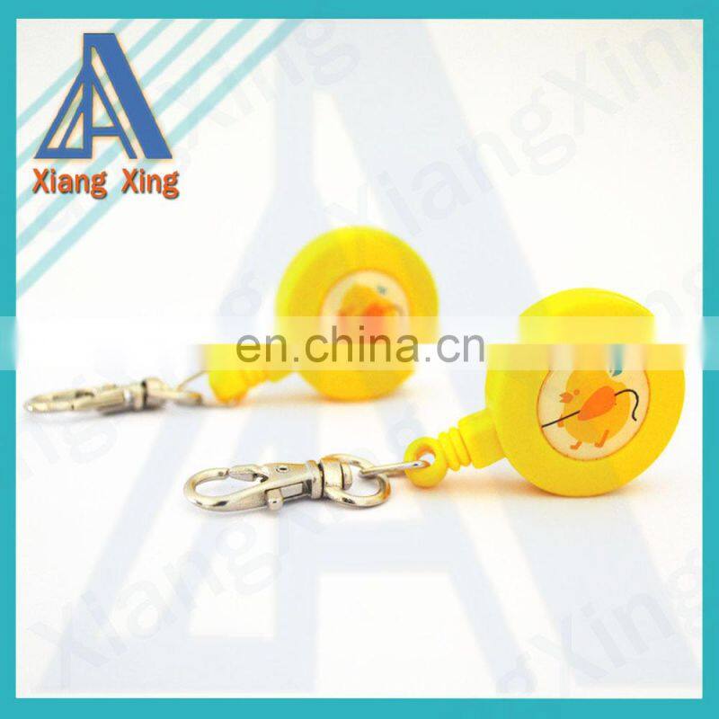 Round plastic logo attached badge with retractable string reels