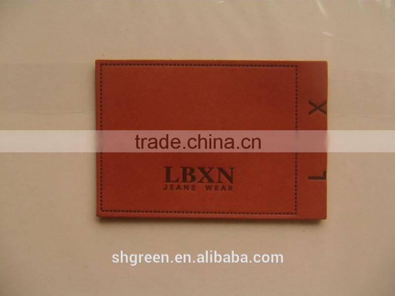 Soft debossed company name leather tags for suits