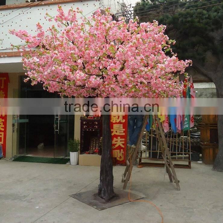 Yellow silk cherry blossom tree with artificial flower
