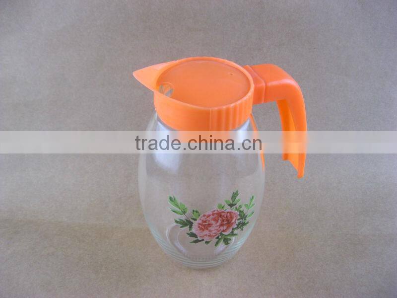 clear round glass water jug with plastic lids and handles