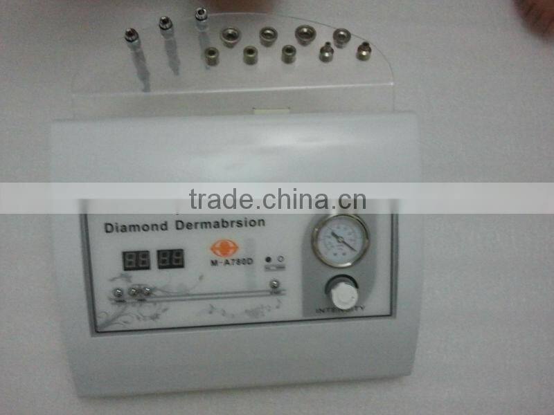 Portable diamond tip microdermabrasion machine