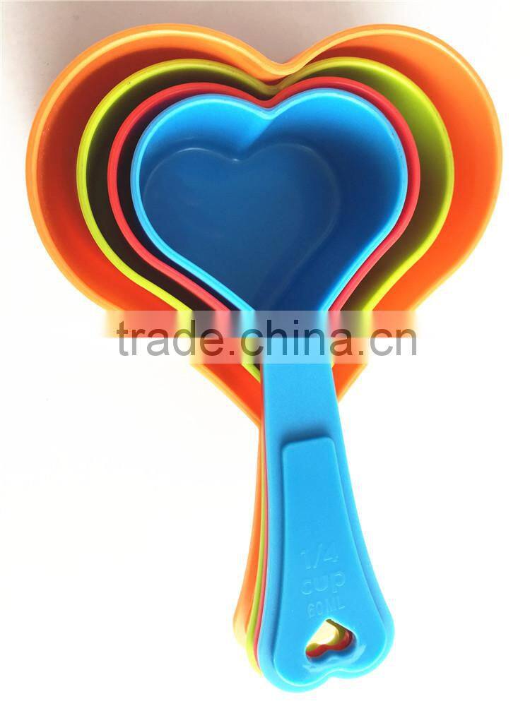 Small plastic measuring cups