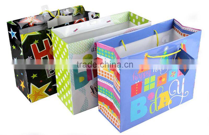 Wholesale custom folding shopping birthday paper gift bags with handles