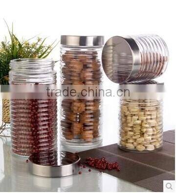 clear cylinder glass storage jar with air bubbles and stainless steel lid