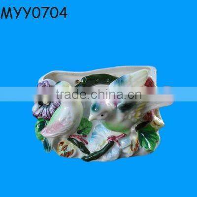 white ceramic human shape candle stand