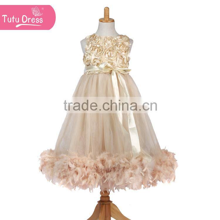 The ivory color girls boutique dress with fluffy feather