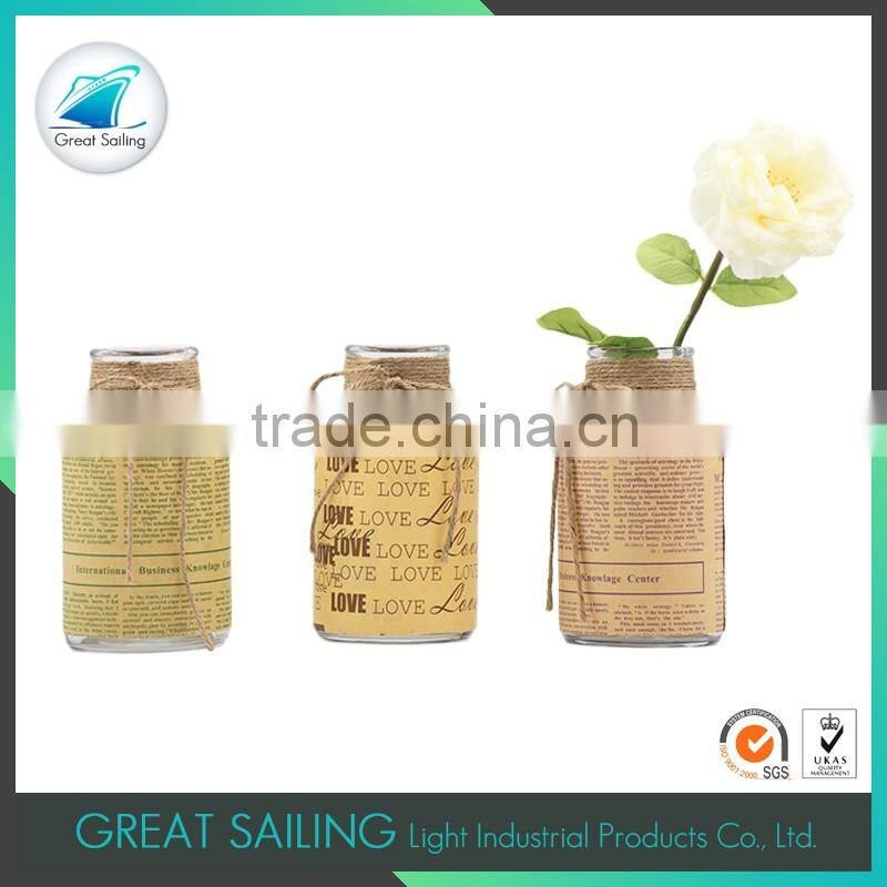 creative mini glass vase centerpiece with newspaper coating