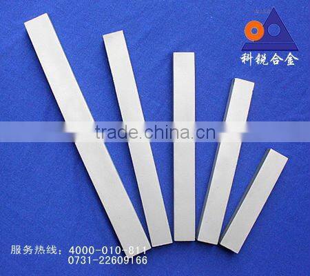 VSI rotor tip with carbide bar