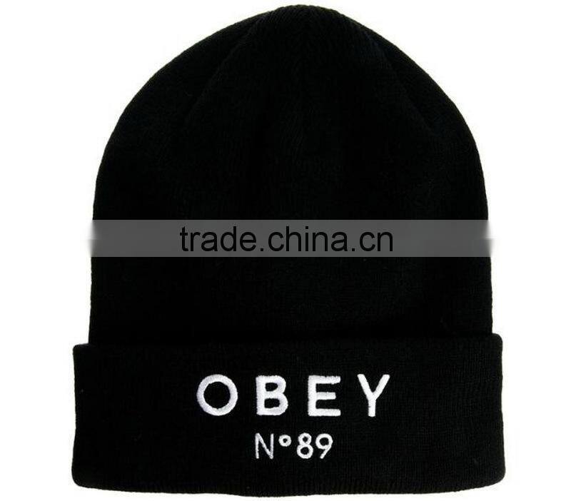 100% polyester black hat beanie with logo embroidery on the rolled cuff