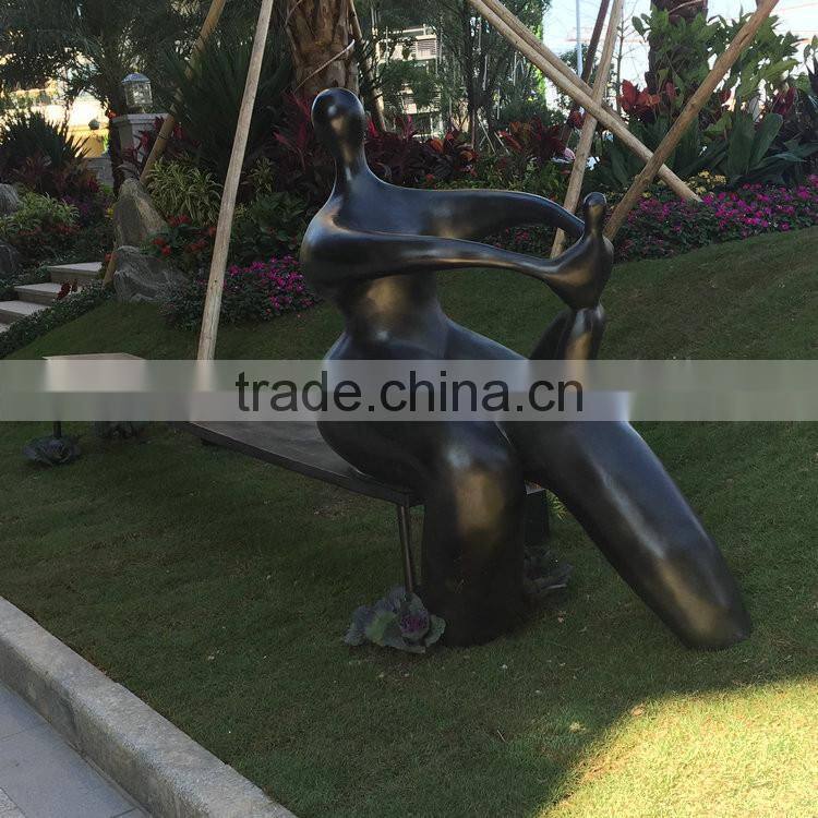 Fiberglass man character on bench