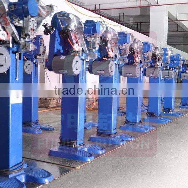 Jeans button attaching machine