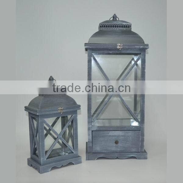 Brown wooden candle lantern with drawers