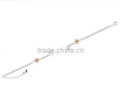 Women stainless steel chain bracelet with black and gold beads