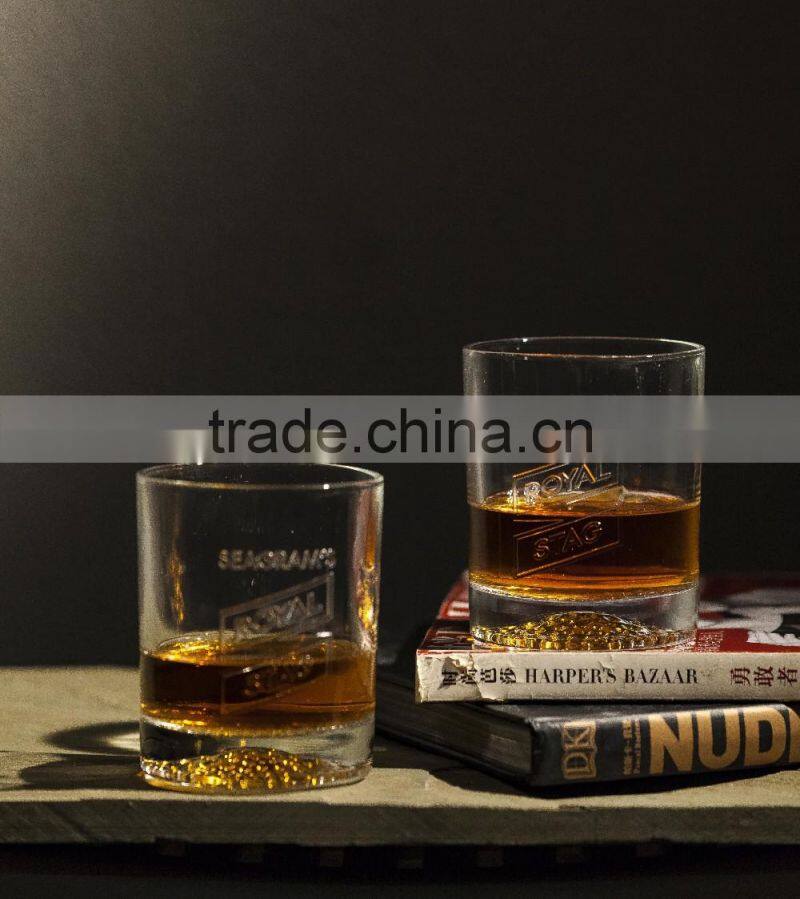 300ml clear glass cup with small bubbles at the bottom and embossed letter for drinking