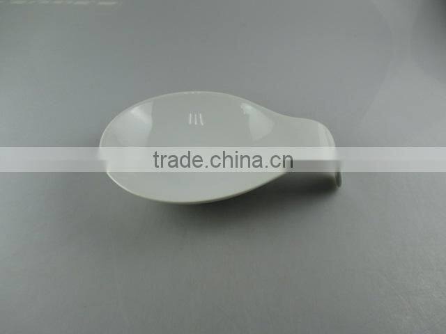 white porcelain dish with spoon shape