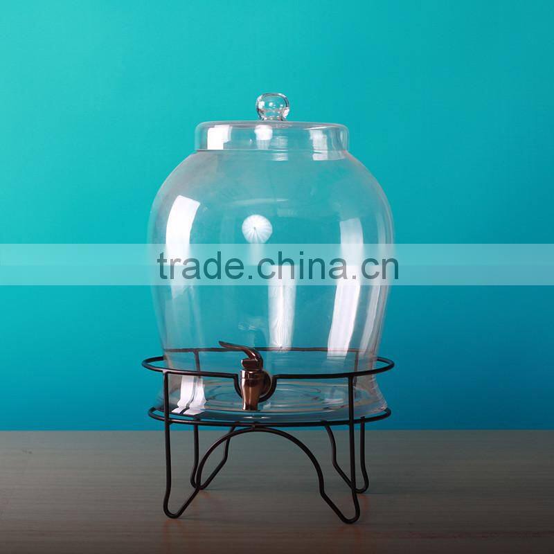 Glass beverage dispenser with tap and metal base and glass cover