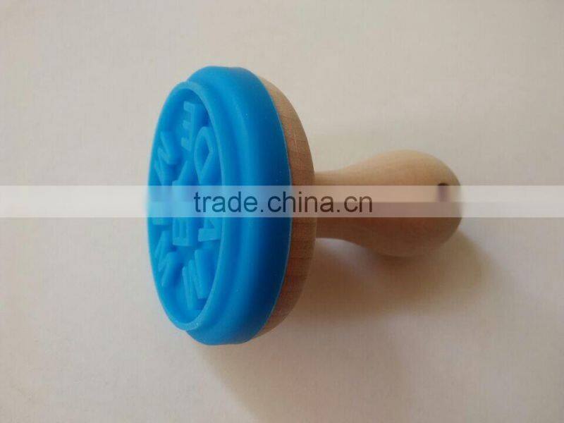 interesting silicone cookie stamp with wooden handle