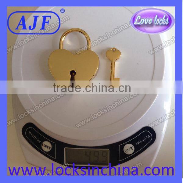 Heart shaped lock and key with gold color